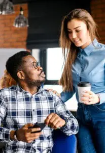 man and women talking over coffee